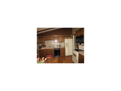 Updated kitchen includes appliances.