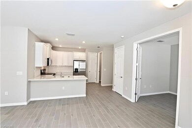 Kitchen featuring stainless steel appliances, ligh