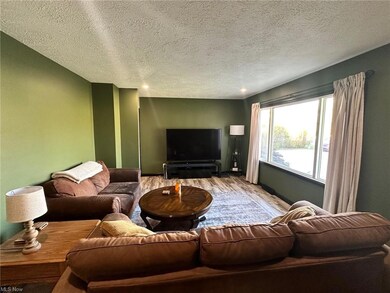 Living room featuring light wood-type flooring and