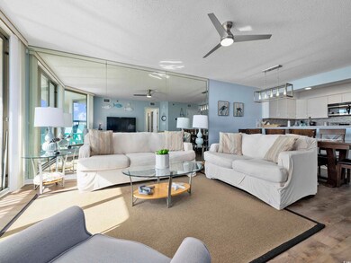 Living area with ceiling fan, a textured ceiling, 