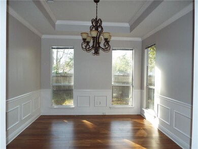 Dining room with NEW wood flooring, wainscoting an