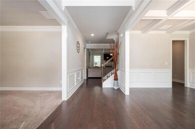 Foyer entrance featuring crown molding, wainscotin