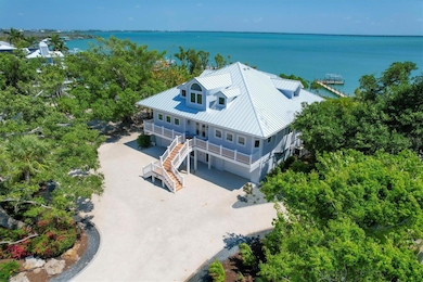 Renovated with Impact Windows, New Metal Roof, Kitchen and Baths!