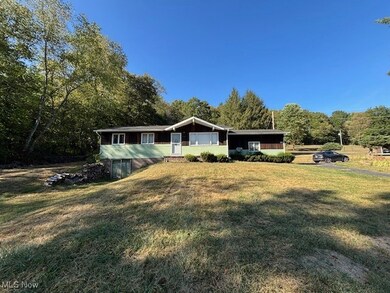 Single story home with a front yard