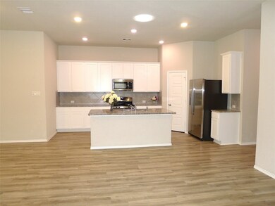 Another view of this large island kitchen offers breakfast bar, lots of 42