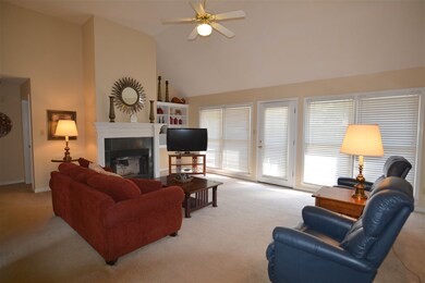 Fireplace is the focal point of this vaulted great