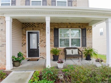 Lovely covered front porch to enjoy a fall afterno