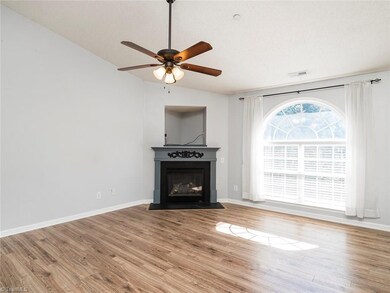 The large window brings in beautiful natural light! Notice the ceiling fans!