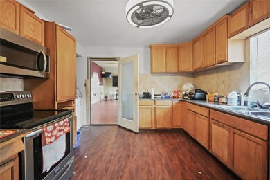 Kitchen with sink, appliances with stainless steel