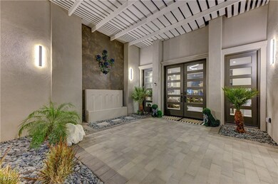 Twilight photo of the stunning courtyard entry int
