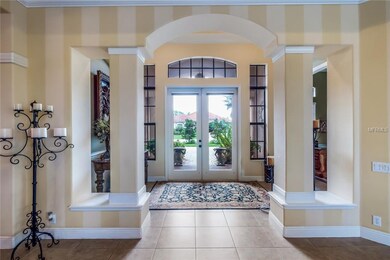 Foyer; framed with an arched and pillar design ent