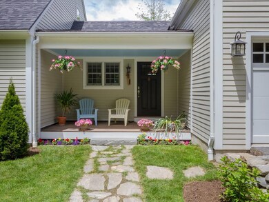 The covered entry porch makes for an...