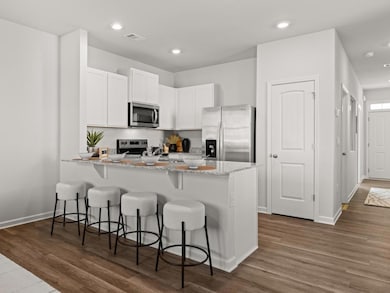 Pearson kitchen open to the living area with white