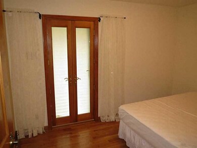 Bedroom. Patio doors to the back yard from third b
