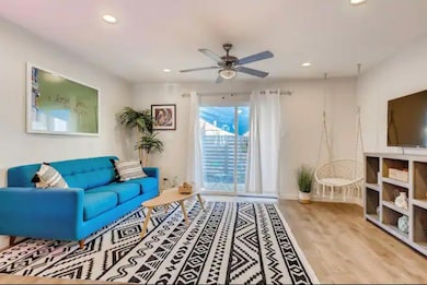 Living area featuring wood finished floors, baseb