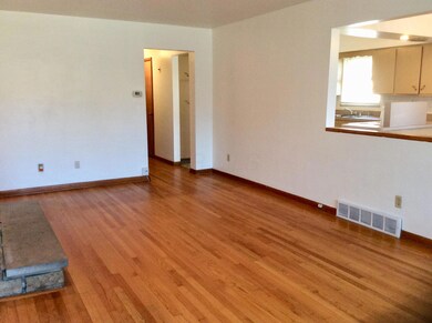 Large living room with stone fireplace