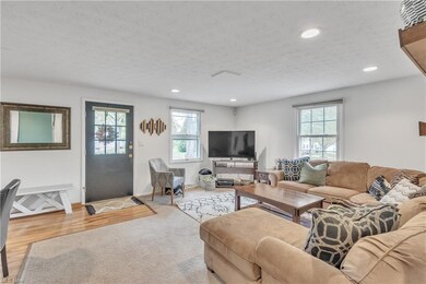 Living room featuring light hardwood / wood-style 