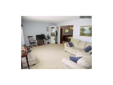 The large foyer opens to the formal living room