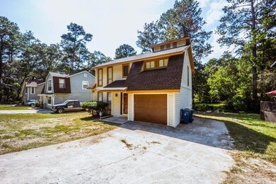 View of front of property with a garage and a fron