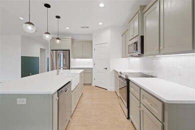 Kitchen with stainless steel appliances, tasteful 
