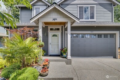 Front view of house, with Newer Roof (2020), and Insulated Garage Door! New cement path from driveway to the door for extra convenience!