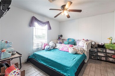 Bedroom featuring wood finished floors and ceiling