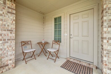 A welcome area for sitting with family, friends, and neighbors under the covered front porch.