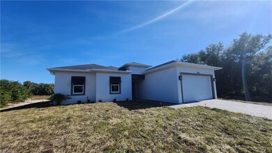 View of front of house with a garage and a front l