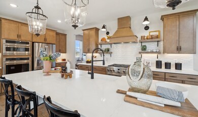 Kitchen with pendant lights over island