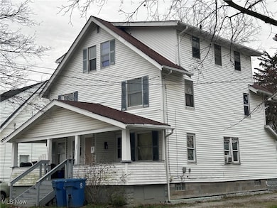 View of front of house featuring covered porch and roof with shingles