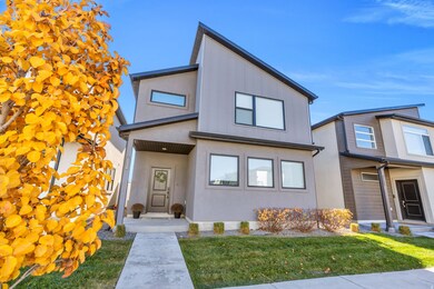 View of front of home with a front lawn and stucco siding