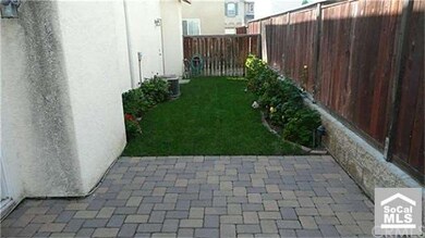 Backyard with pavers and landscaping.