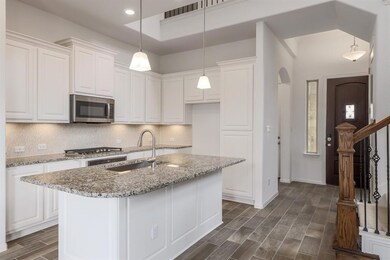 Kitchen featuring stainless steel appliances, a s
