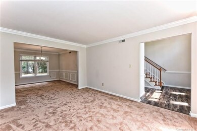 Living Room opens up to Foyer and Dining Room!