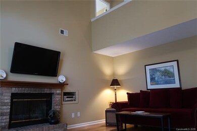 Vaulted great room with hardwood floors and woodbu