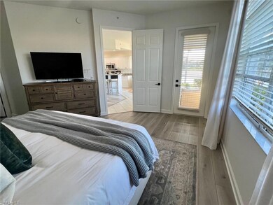 Bedroom featuring light hardwood / wood-style floo