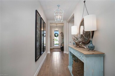 Entry with custom lights. Wood-look tile throughou