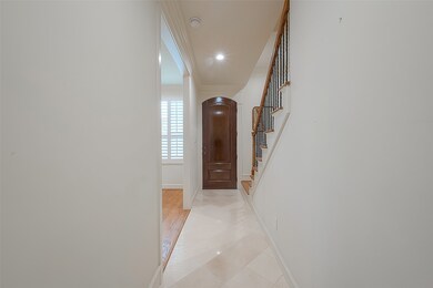 This photo features a bright entryway with a polis