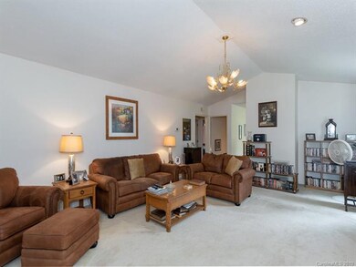 Large living room with cathedral ceiling.