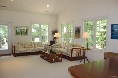 The sun room has door to the patio and eating area