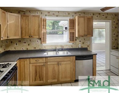 Kitchen. Kitchen opens to additional living room/d