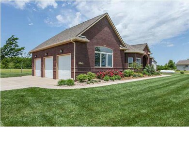 Oversized 3-car attached side load garage.