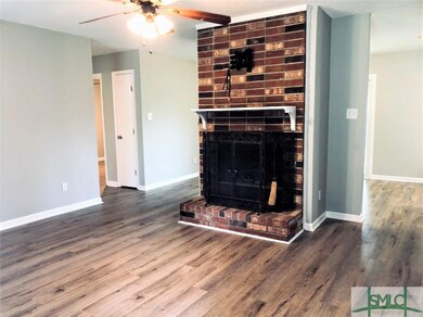 This gorgeous, gas insert, brick fireplace is the 