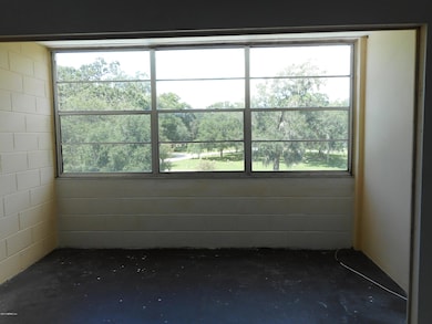 Enclosed sun porch overlooking pool
