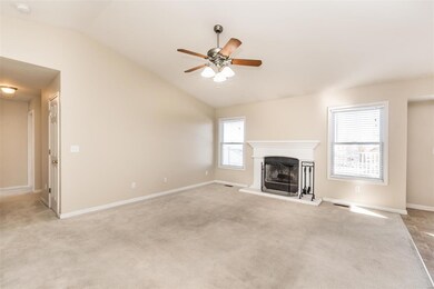 Family Room w/ vaulted ceilings and wb fireplace