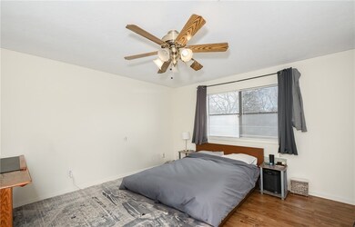 Bedroom featuring baseboards, a ceiling fan, and w
