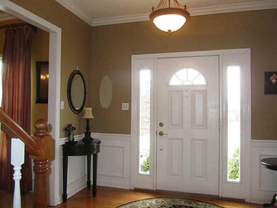 Entry/Foyer. Entry with hardwood floor, crown mold