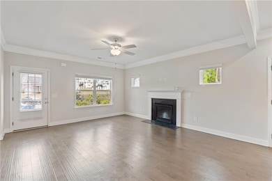 Unfurnished living room with a fireplace with flus
