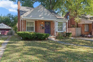 Bungalow-style house featuring a chimney, a gate, and brick siding