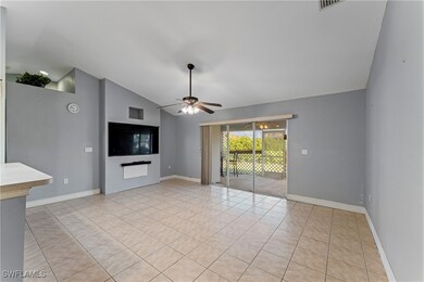 Unfurnished living room featuring ceiling fan, lof